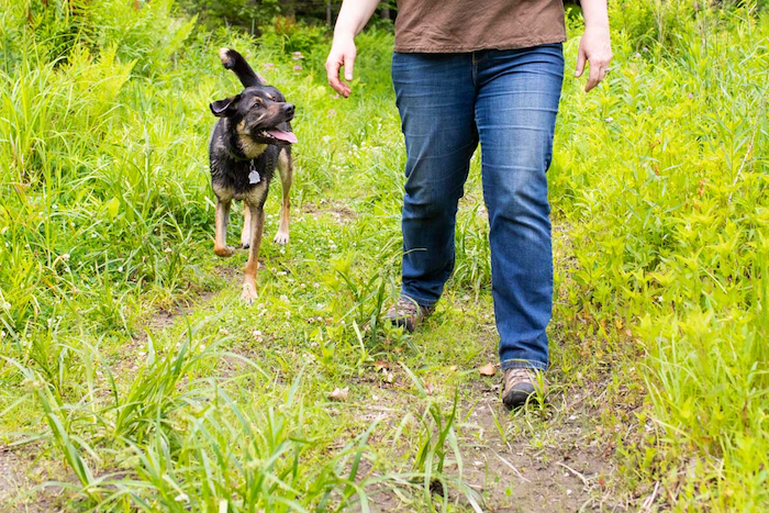 Asha and Marilyn walk along a trail together